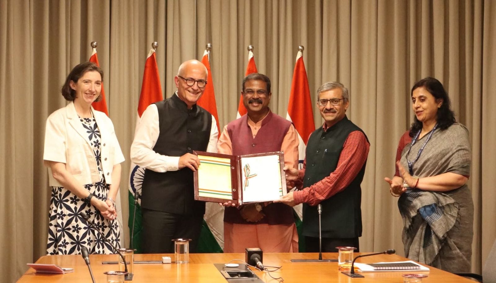 Union Education Minister Dharmendra Pradhan hands over approval letters to representatives of foreign universities cleared to establish campuses in India.