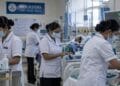 Nurses attending to patients at a hospital ward