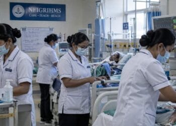 Nurses attending to patients at a hospital ward